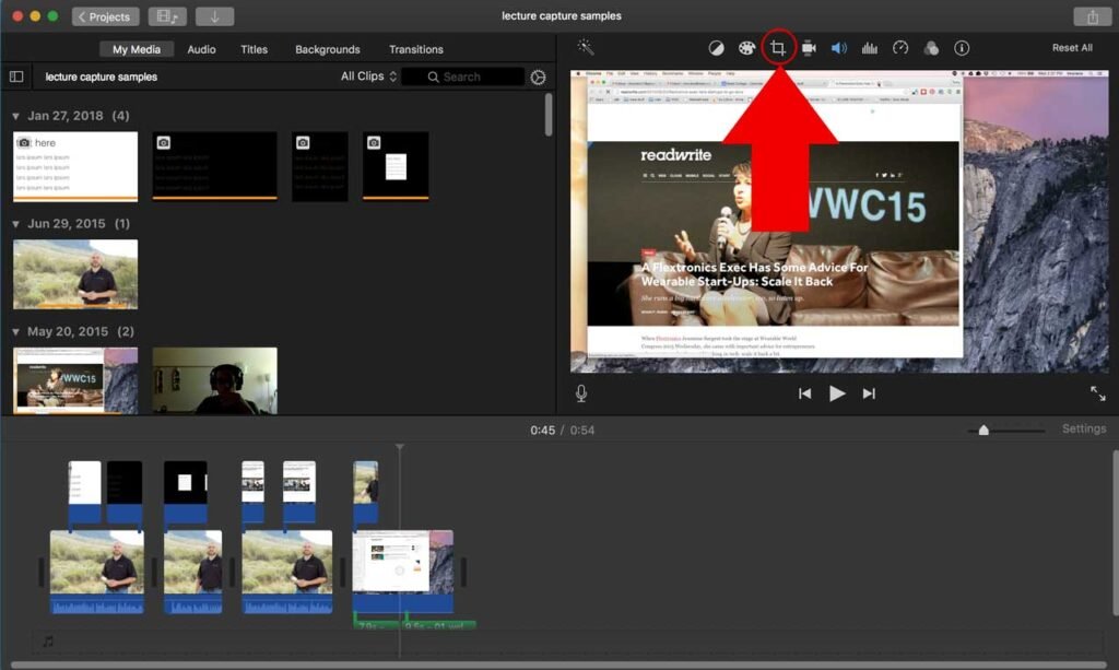 iMovie video editing interface showing a project timeline with clips, a media library on the left, and a preview window on the right. A red arrow points to the crop tool icon in the toolbar above the preview window, indicating its functionality for cropping video footage.