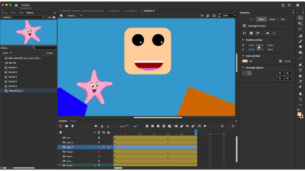 A screenshot of an Adobe Animate workspace showing an animation project. The center of the screen features a smiling cartoon face and a pink starfish character on a blue background, with geometric shapes like a blue polygon and an orange square. The left side displays the "Library" panel with various symbols, including the starfish. The right panel shows object properties, including position, size, and rectangle options. At the bottom, the timeline is visible, displaying layers and keyframes used for animation.