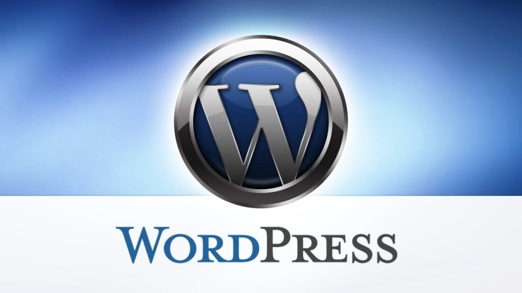 WordPress logo featuring a metallic 'W' encased in a glossy, circular design with a blue gradient background, accompanied by the text 'WordPress' below in a serif font.